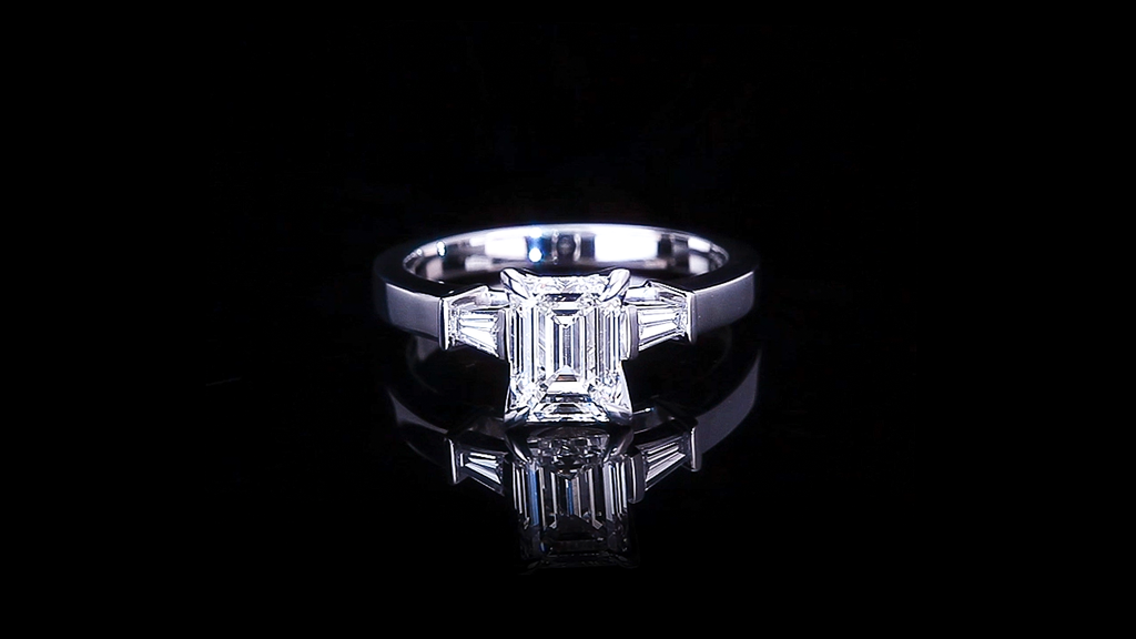 Upswept 1.50ct Emerald cut diamond engagement ring with tapered baguette diamonds in 18ct white gold by Stefano Canturi