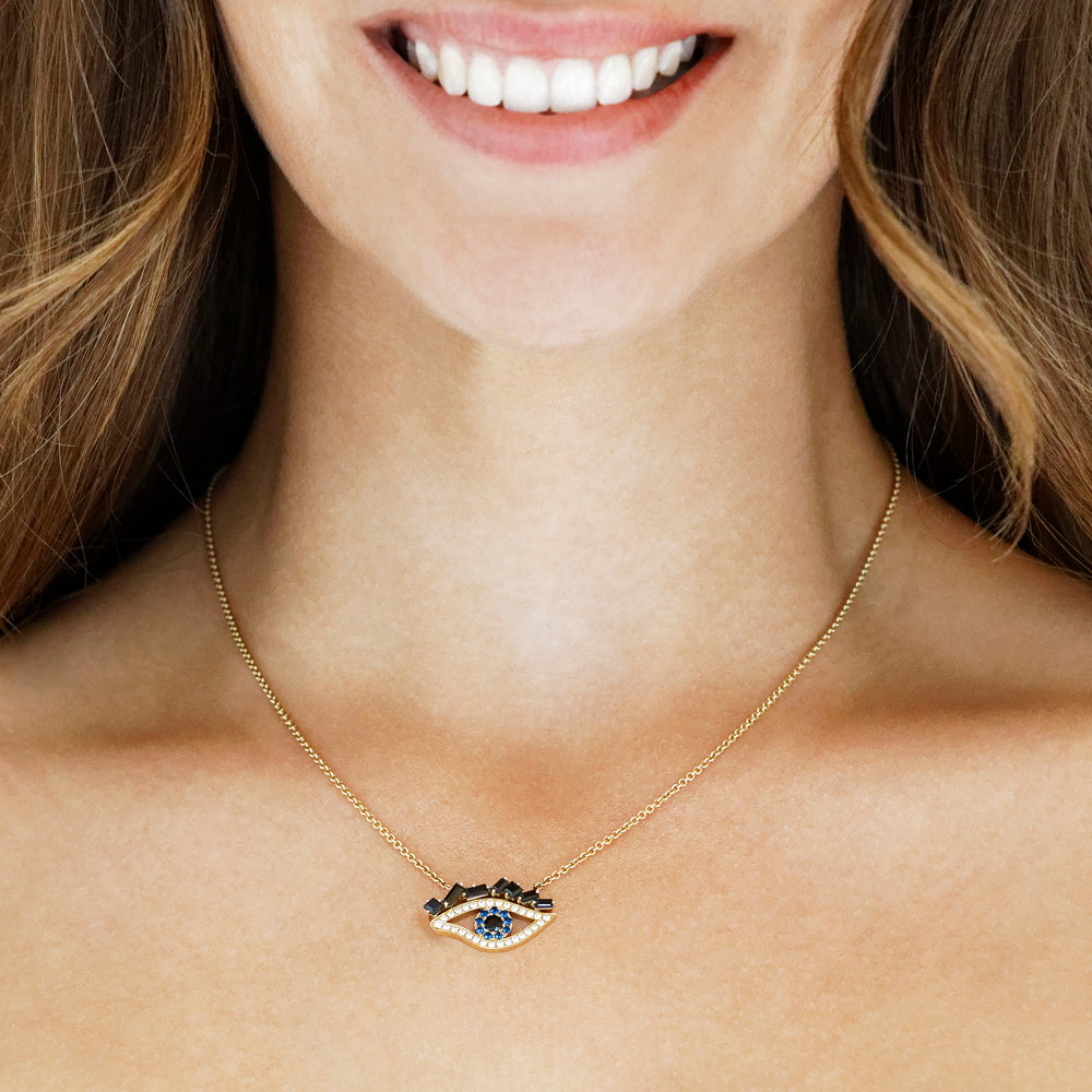 Cubism Eye pendant necklace set in 18ct yellow gold with Australian black sapphires, diamonds, spinel gemstones by Stefano Canturi. Cubism Eye pendant necklace set in 18ct yellow gold with Australian black sapphires, diamonds, spinel gemstones by Stefano Canturi.