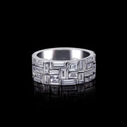 alt="Elegant Classic Cubism diamond ring in 18ct white gold, featuring baguette and carré cut diamonds in a sophisticated arrangement by Stefano Canturi"