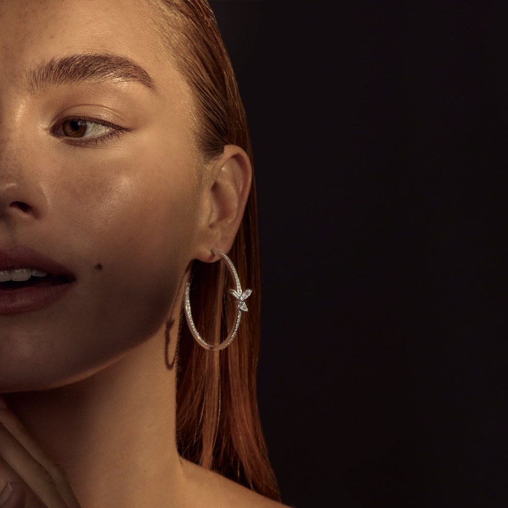 Primavera Hoop Earrings by Canturi – Elegant, sculptural hoop earrings featuring exquisite diamonds, handcrafted for timeless luxury.