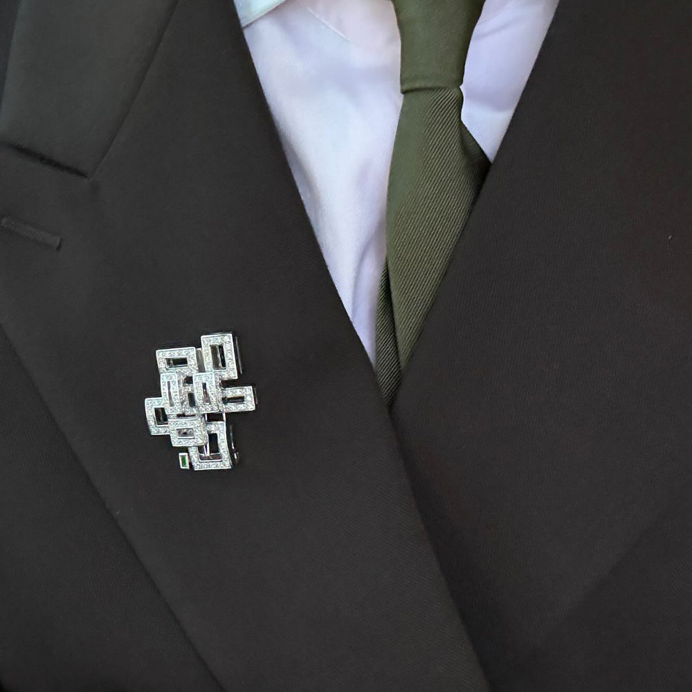 Geometric diamond and Zambian green emerald brooch by Stefano Canturi