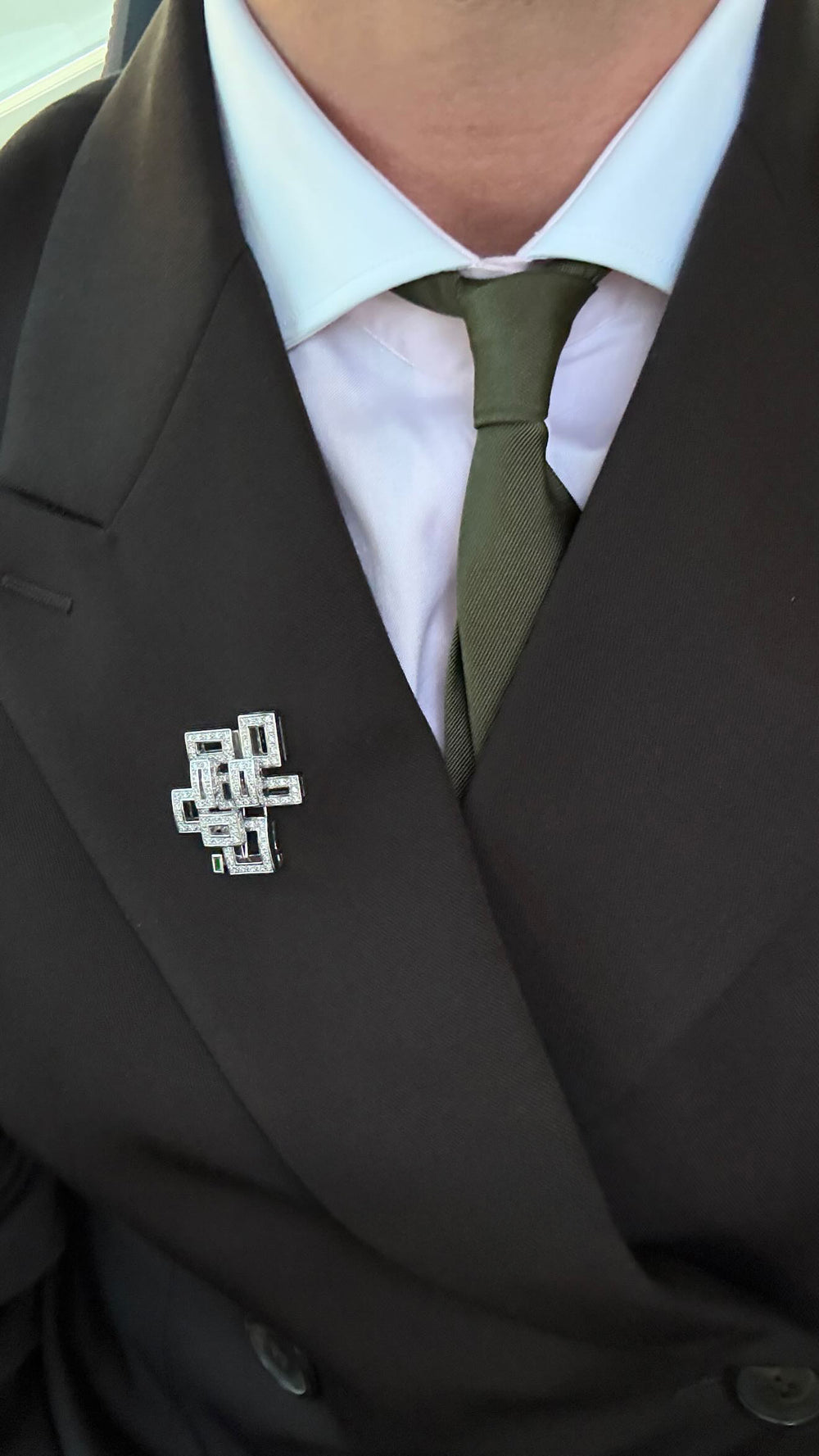 Geometric diamond and Zambian green emerald brooch by Stefano Canturi