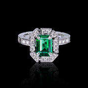 Regina diamond halo ring with Zambian green emerald in 18ct white gold by Stefano Canturi
