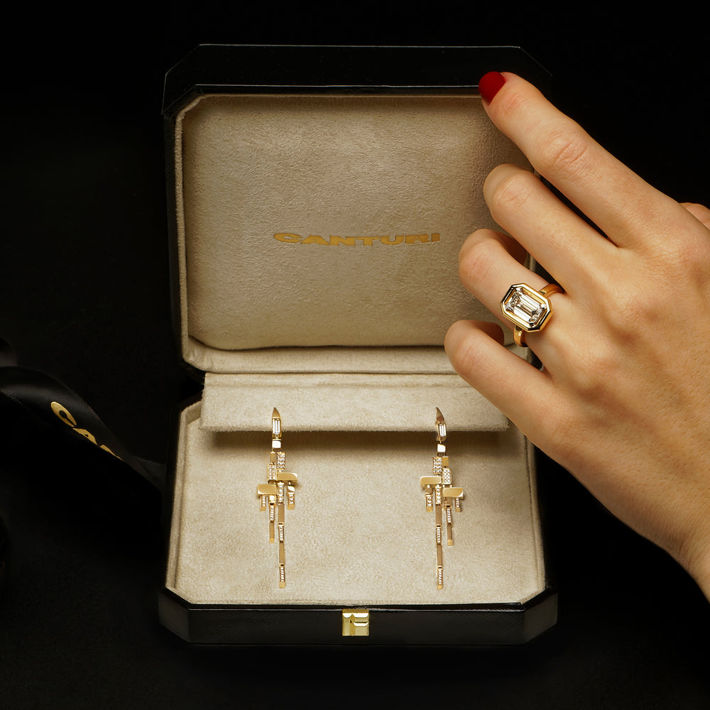 Cubism alternate diamond drop earrings set in 18ct yellow gold and Athena 3.01ct Emerald Diamond Ring in 18ct yellow gold by Stefano Canturi 