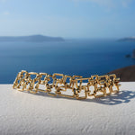 Affinity 3 row woven bracelet in yellow gold by Stefano Canturi
