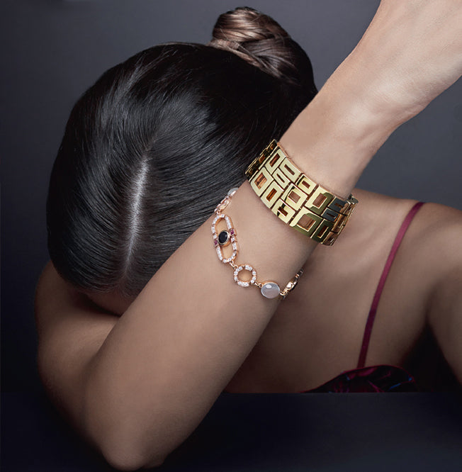 Regina diamond, ruby, Australian black sapphire, moonstone bracelet in 18ct pink gold and Geometric cuff by Stefano Canturi